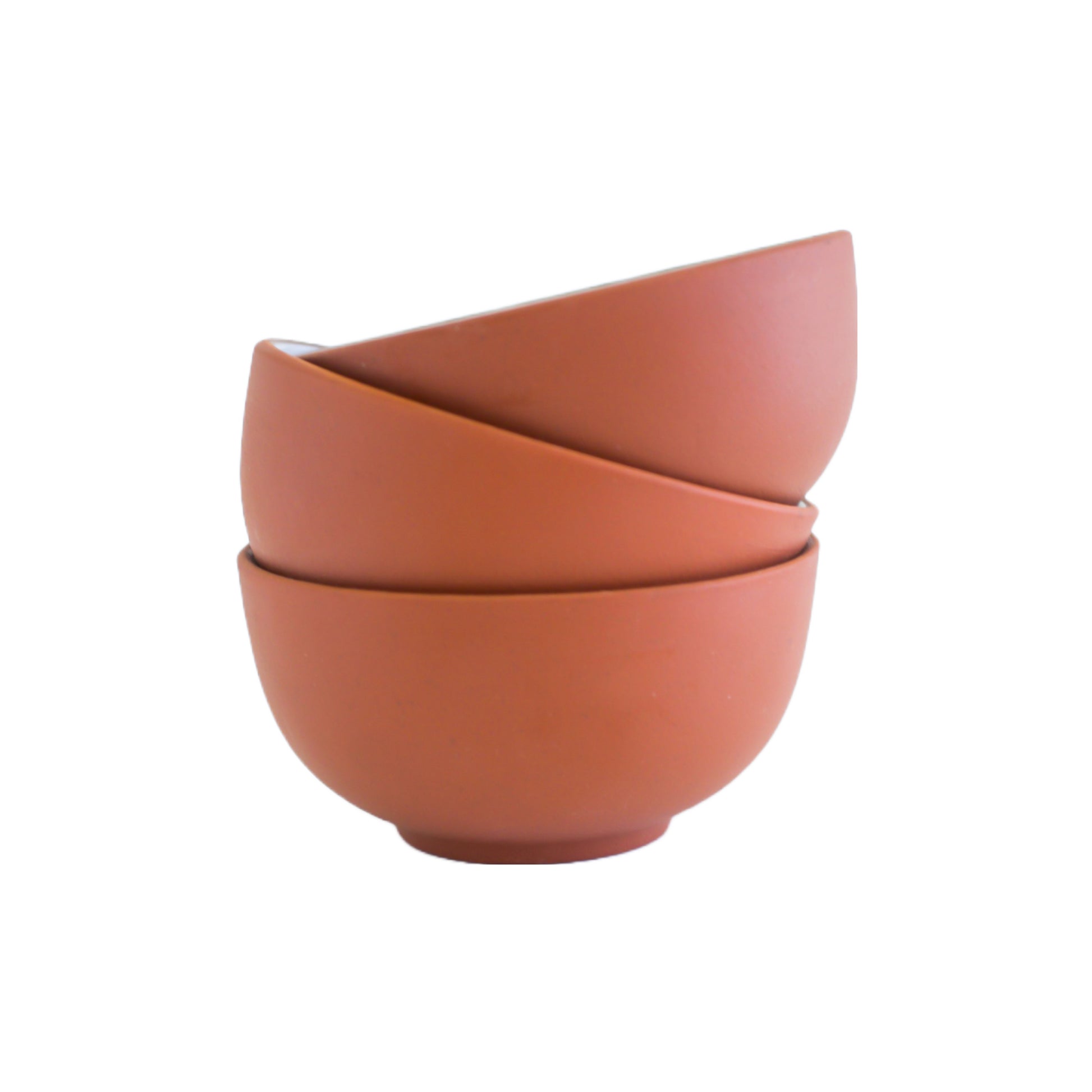 3 clay colored mini mixing bowls stacked