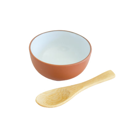 Clay colored mini mixing bowl with bamboo spoon